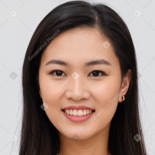 Joyful asian young-adult female with long  brown hair and brown eyes