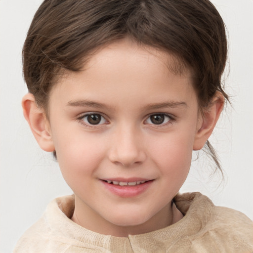 Joyful white child female with short  brown hair and brown eyes