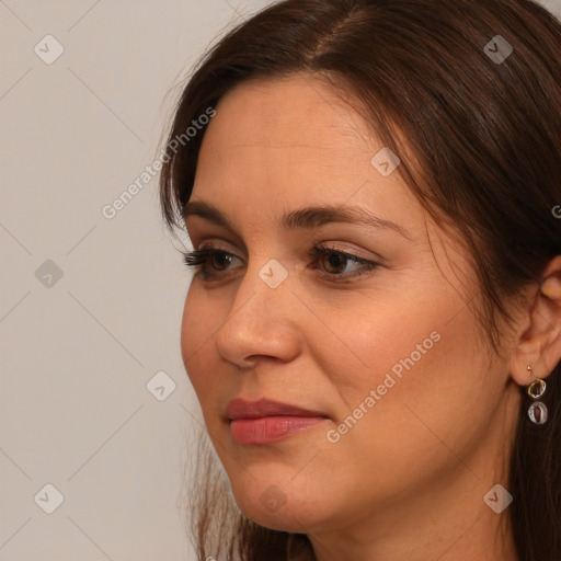 Joyful white adult female with long  brown hair and brown eyes