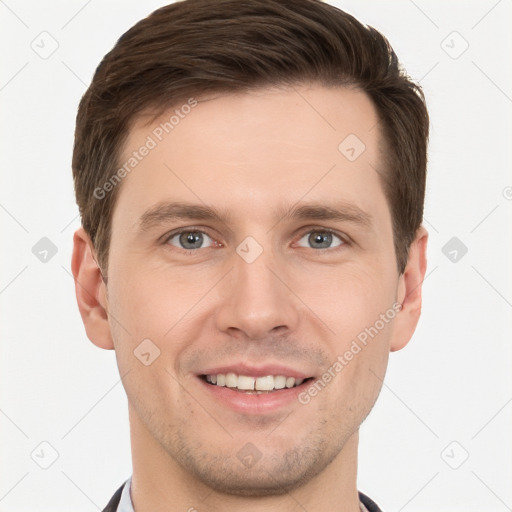 Joyful white young-adult male with short  brown hair and grey eyes