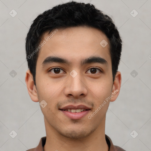 Joyful latino young-adult male with short  black hair and brown eyes