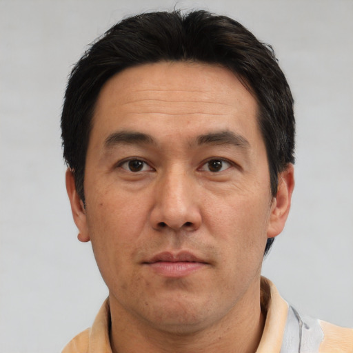 Neutral asian adult male with short  black hair and brown eyes