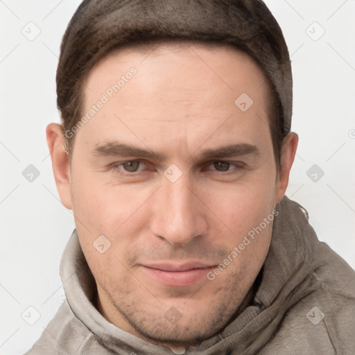 Joyful white adult male with short  brown hair and grey eyes