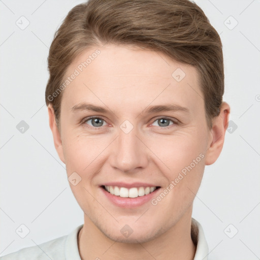 Joyful white young-adult female with short  brown hair and grey eyes