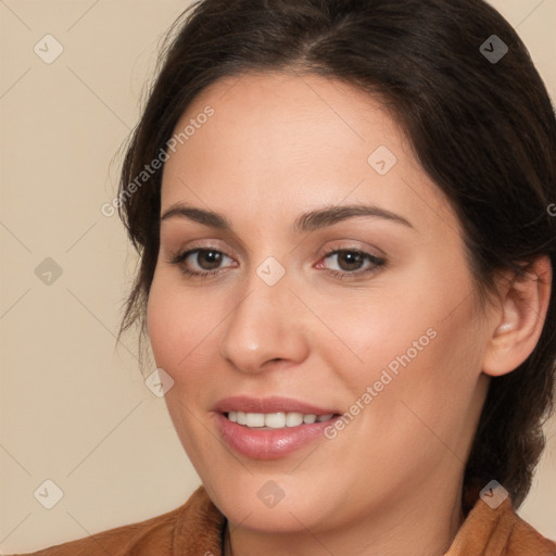 Joyful white young-adult female with medium  brown hair and brown eyes