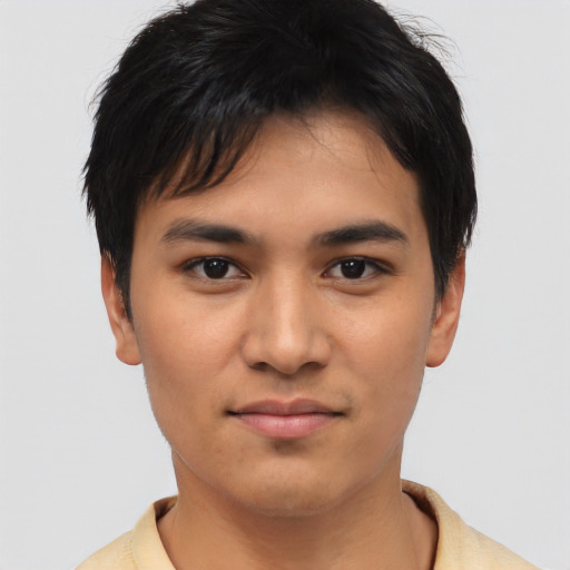 Joyful asian young-adult male with short  black hair and brown eyes