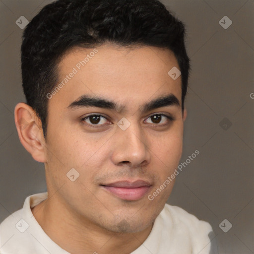 Joyful latino young-adult male with short  brown hair and brown eyes