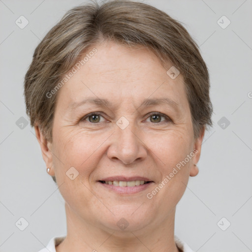 Joyful white adult female with short  brown hair and grey eyes