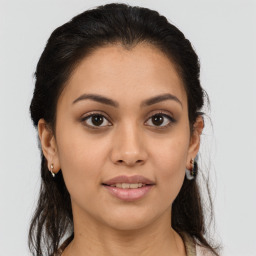 Joyful white young-adult female with medium  brown hair and brown eyes