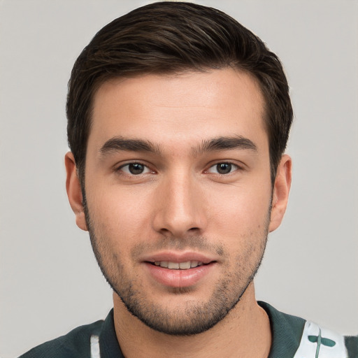 Joyful white young-adult male with short  brown hair and brown eyes