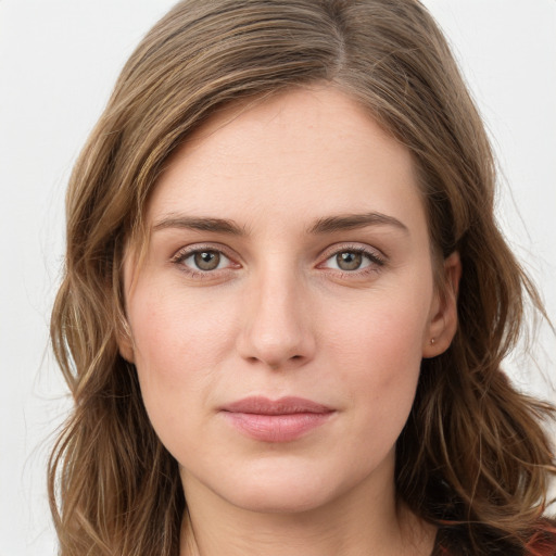 Joyful white young-adult female with long  brown hair and green eyes