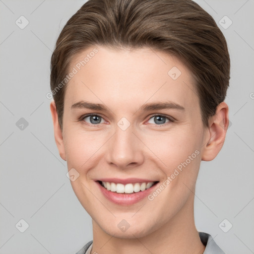 Joyful white young-adult female with short  brown hair and grey eyes