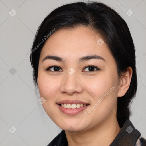 Joyful asian young-adult female with medium  brown hair and brown eyes