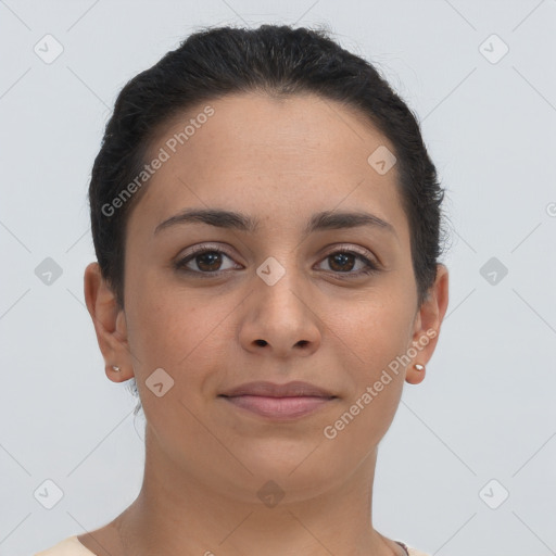 Joyful latino young-adult female with short  brown hair and brown eyes