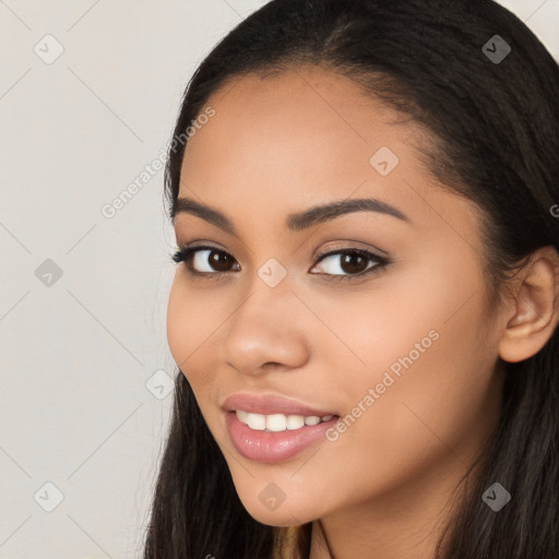 Joyful latino young-adult female with long  brown hair and brown eyes