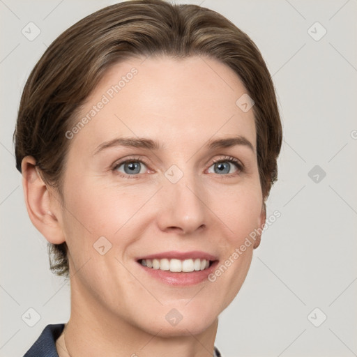 Joyful white young-adult female with short  brown hair and grey eyes