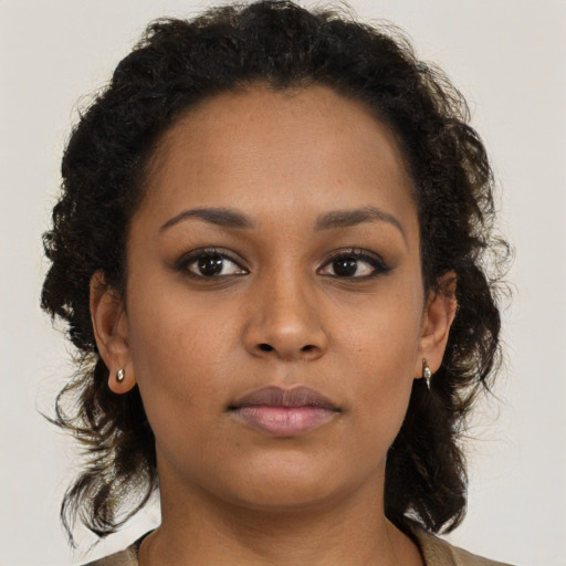 Neutral black young-adult female with medium  brown hair and brown eyes