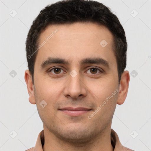 Joyful white young-adult male with short  brown hair and brown eyes