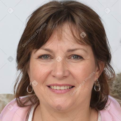 Joyful white adult female with medium  brown hair and grey eyes