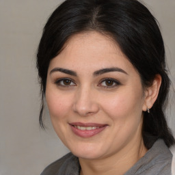 Joyful white young-adult female with medium  brown hair and brown eyes