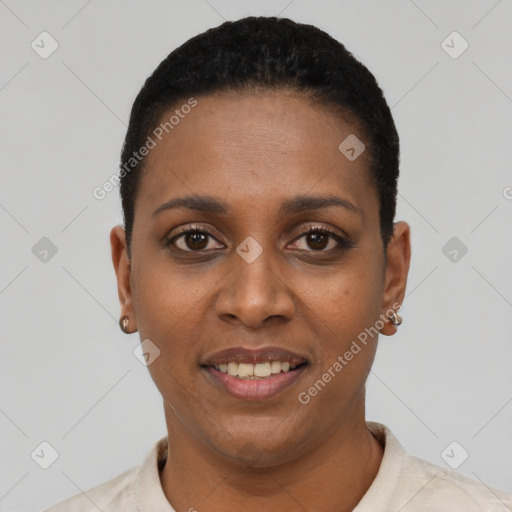Joyful black young-adult female with short  black hair and brown eyes