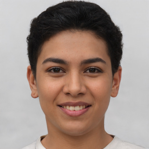 Joyful latino young-adult female with short  brown hair and brown eyes