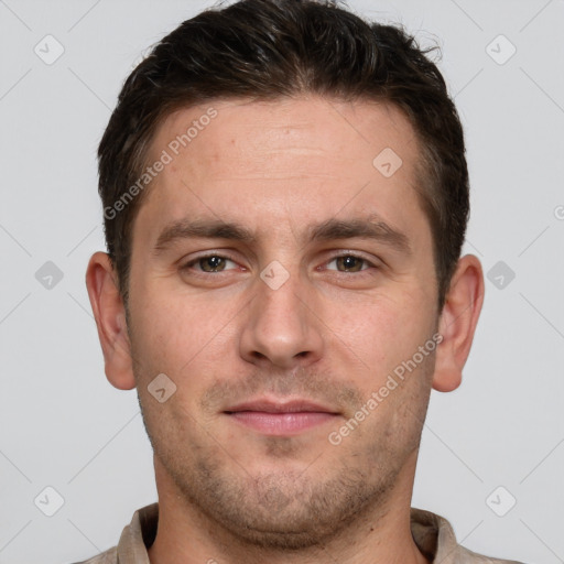 Joyful white young-adult male with short  brown hair and grey eyes