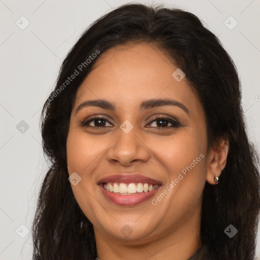 Joyful latino young-adult female with long  brown hair and brown eyes