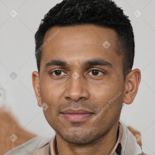 Joyful latino young-adult male with short  black hair and brown eyes