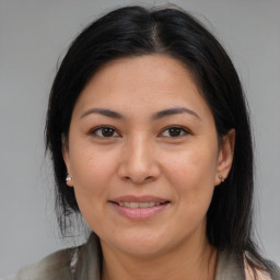 Joyful asian young-adult female with medium  brown hair and brown eyes