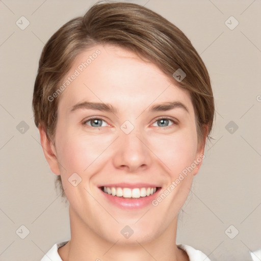 Joyful white young-adult female with medium  brown hair and green eyes