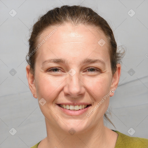 Joyful white adult female with short  brown hair and grey eyes