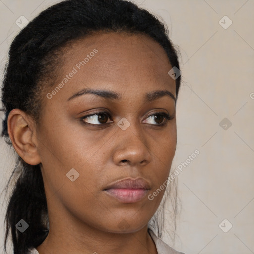 Neutral black young-adult female with medium  brown hair and brown eyes