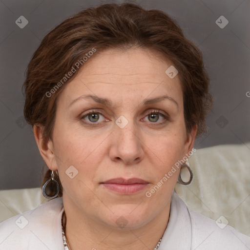 Joyful white adult female with short  brown hair and grey eyes