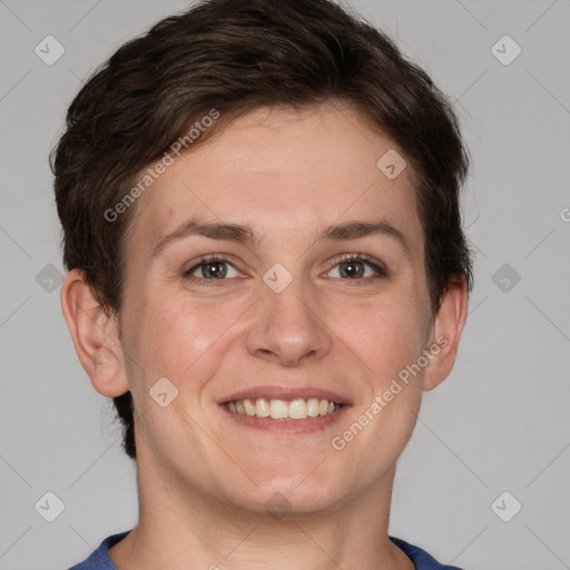 Joyful white young-adult female with short  brown hair and grey eyes