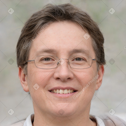 Joyful white adult female with short  brown hair and grey eyes