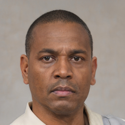 Neutral latino adult male with short  brown hair and brown eyes