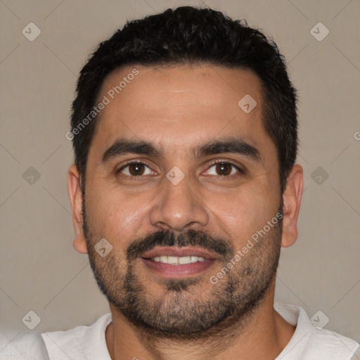 Joyful white young-adult male with short  black hair and brown eyes