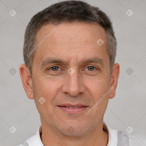 Joyful white adult male with short  brown hair and brown eyes