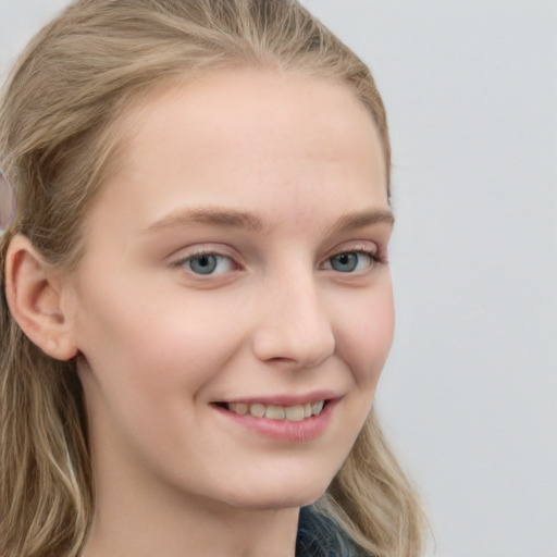 Joyful white young-adult female with long  brown hair and blue eyes