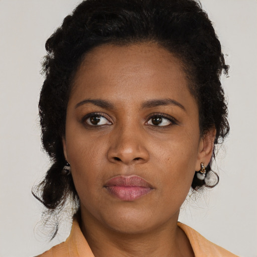 Neutral black young-adult female with medium  black hair and brown eyes