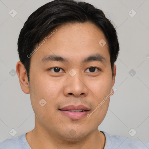 Joyful asian young-adult male with short  brown hair and brown eyes