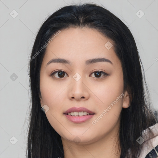 Joyful asian young-adult female with long  black hair and brown eyes