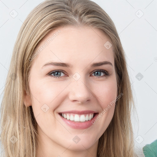 Joyful white young-adult female with long  brown hair and blue eyes