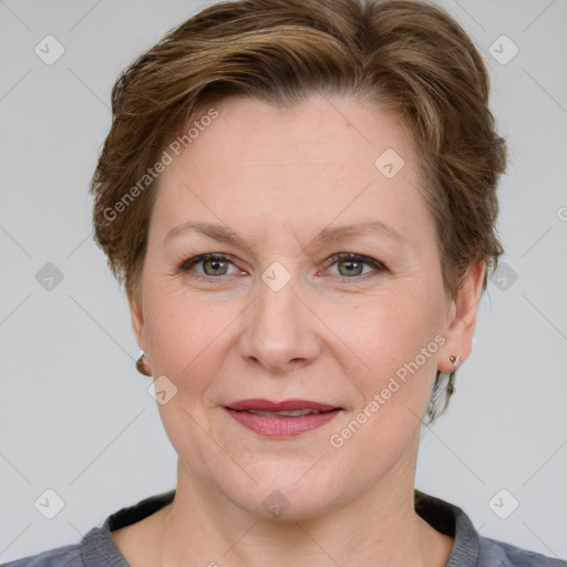 Joyful white adult female with short  brown hair and grey eyes