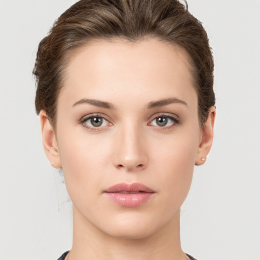 Neutral white young-adult female with short  brown hair and brown eyes