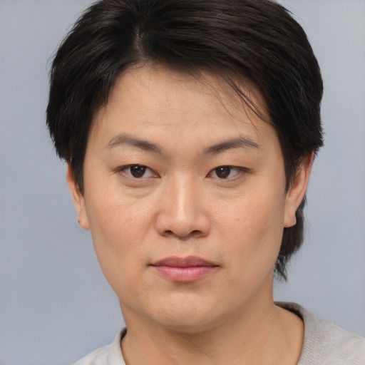 Neutral asian young-adult female with short  brown hair and brown eyes
