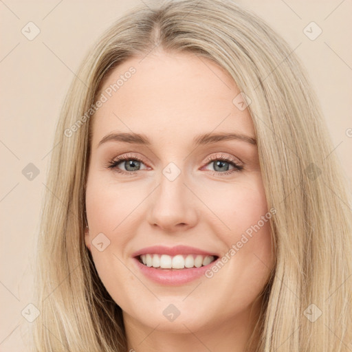 Joyful white young-adult female with long  brown hair and green eyes