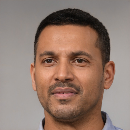 Neutral black adult male with short  black hair and brown eyes