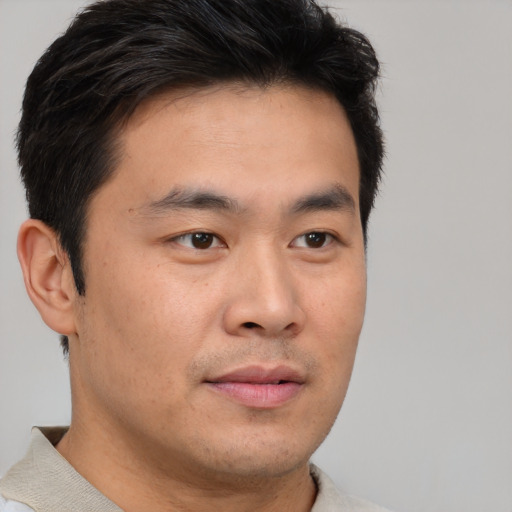 Neutral asian young-adult male with short  brown hair and brown eyes